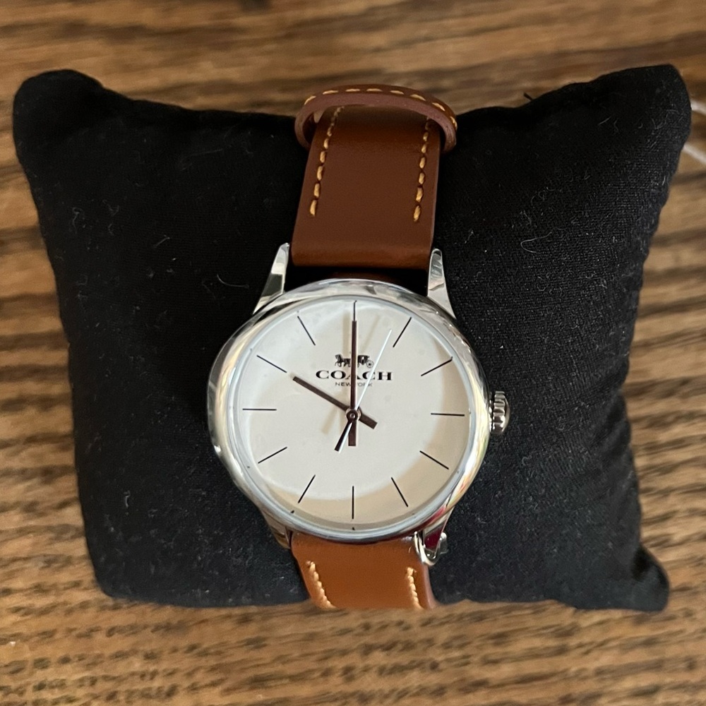 BRAND NEW W/TAGS - Coach leather watch. Watch face has the protective cover